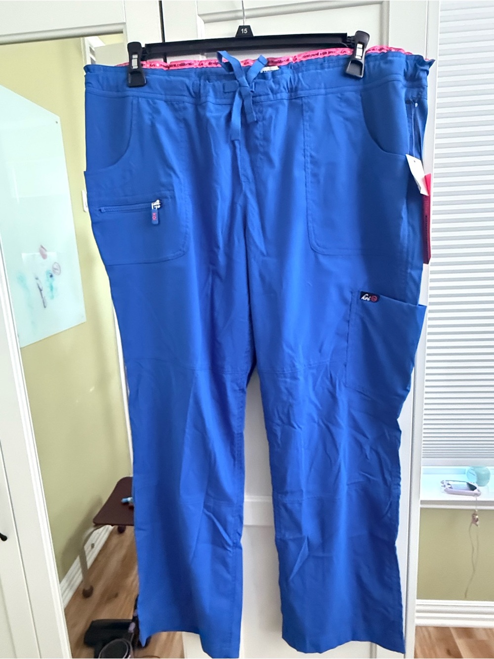 Koi lite Royal Blue woman’s Cargo Scrub Pants with pink accents